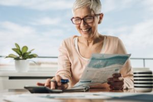 Woman Is Pleased By Saving Money On Bills